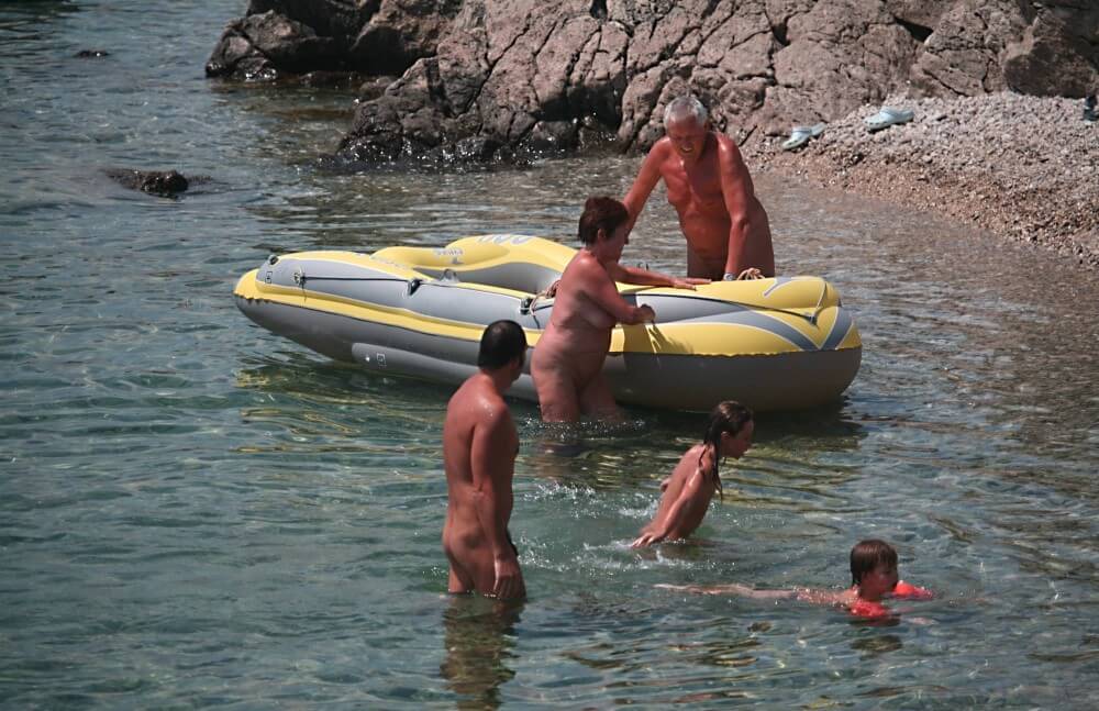 Lone Nudist in Yellow Boat photos - Freedom as the core principle of naturism